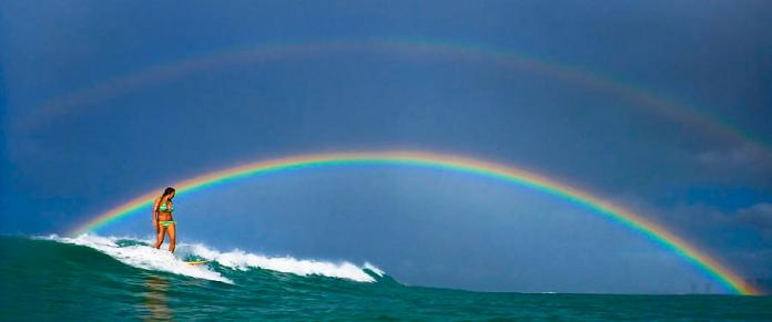 girl-on-surfboard-rainbow